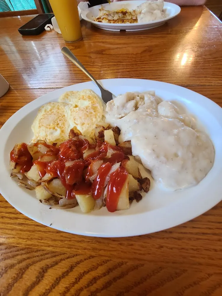 Biscuits and Gravy 2 over Medium Eggs and Home Fries